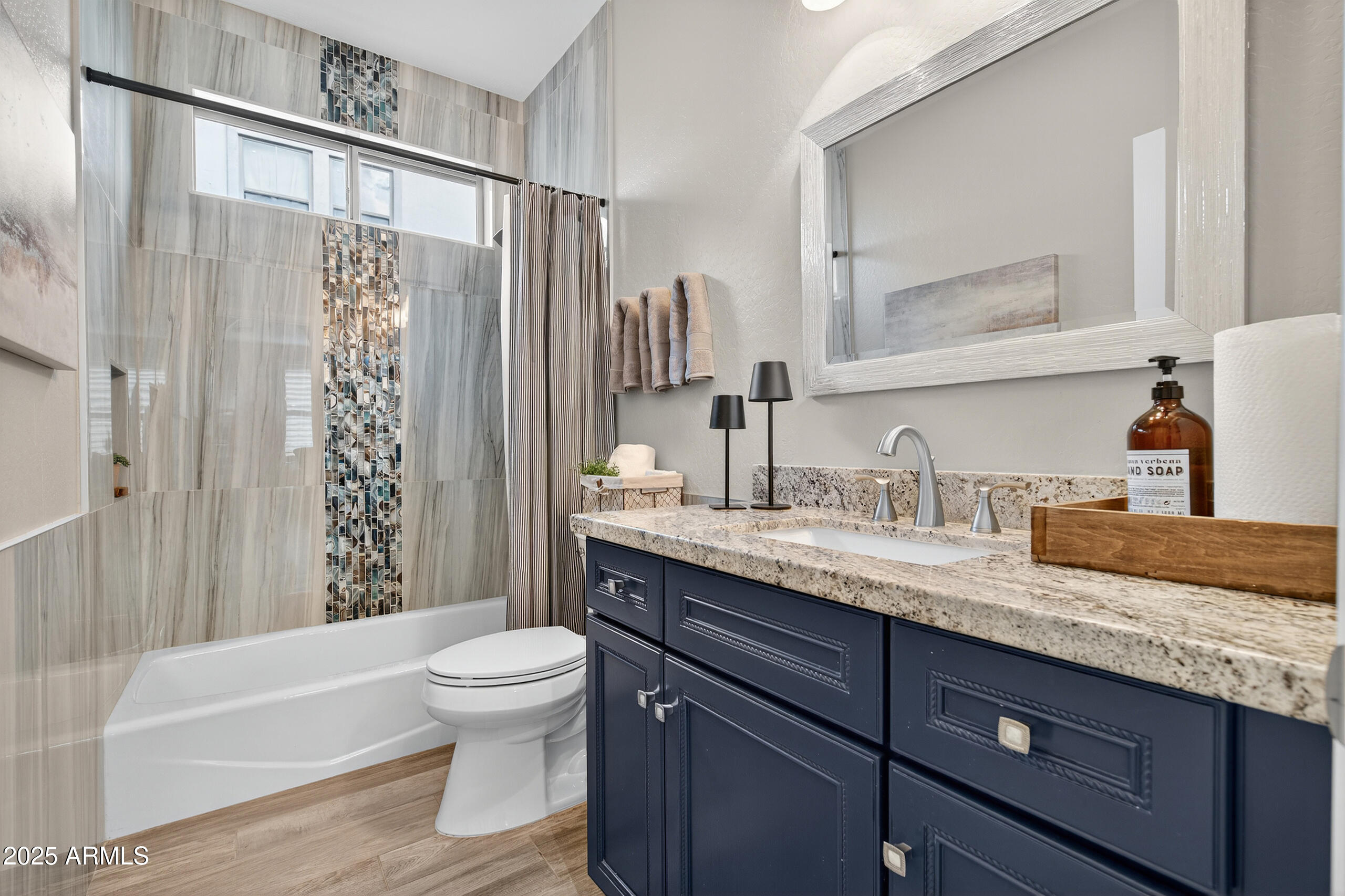 3021 East Agritopia Loop North Gilbert, AZ 85296 - Photo 27 of 68 a bathroom with a granite countertop sink toilet and shower