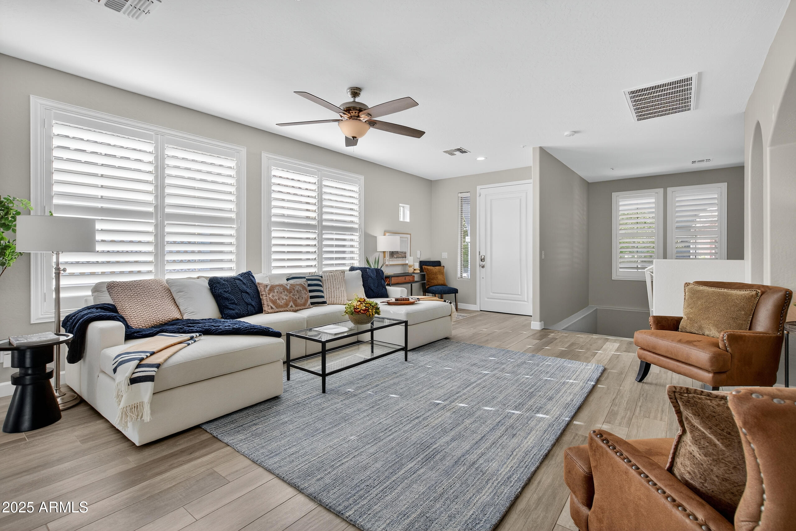 3021 East Agritopia Loop North Gilbert, AZ 85296 - Photo 3 of 68 a living room with furniture and a large window
