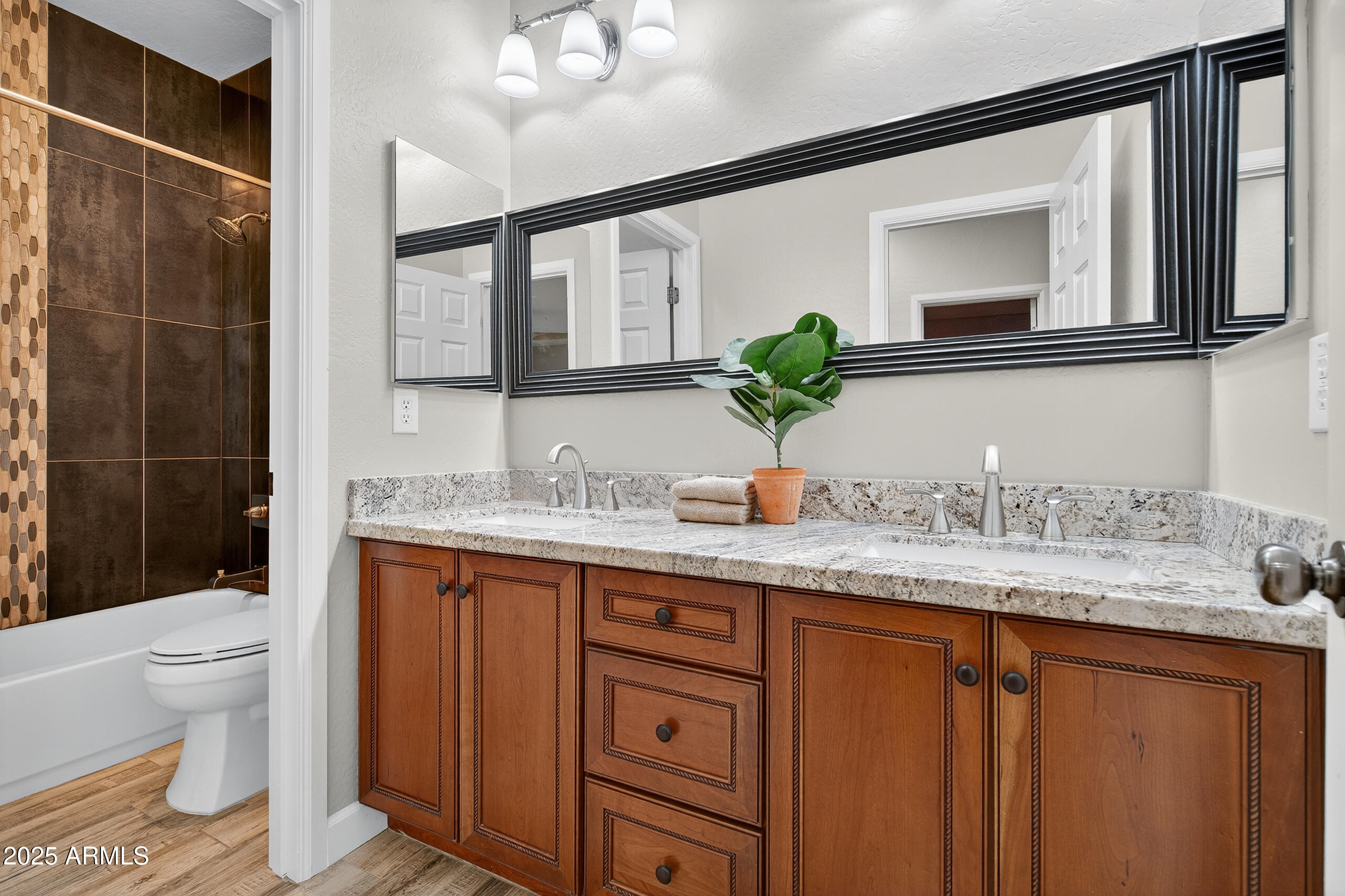 3021 East Agritopia Loop North Gilbert, AZ 85296 - Photo 37 of 68 a bathroom with a granite countertop sink mirror and toilet