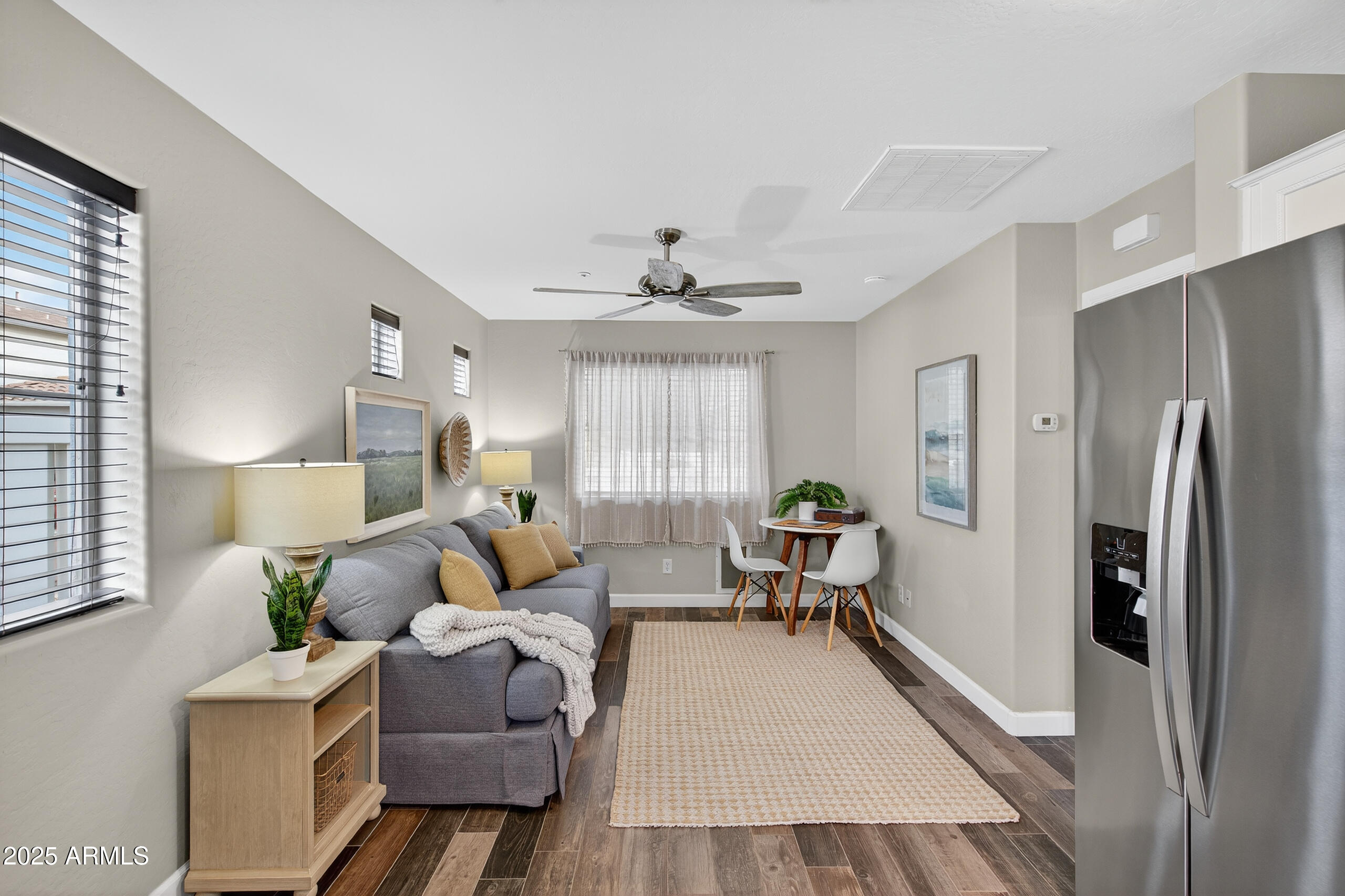 3021 East Agritopia Loop North Gilbert, AZ 85296 - Photo 43 of 68 a living room with furniture and a window