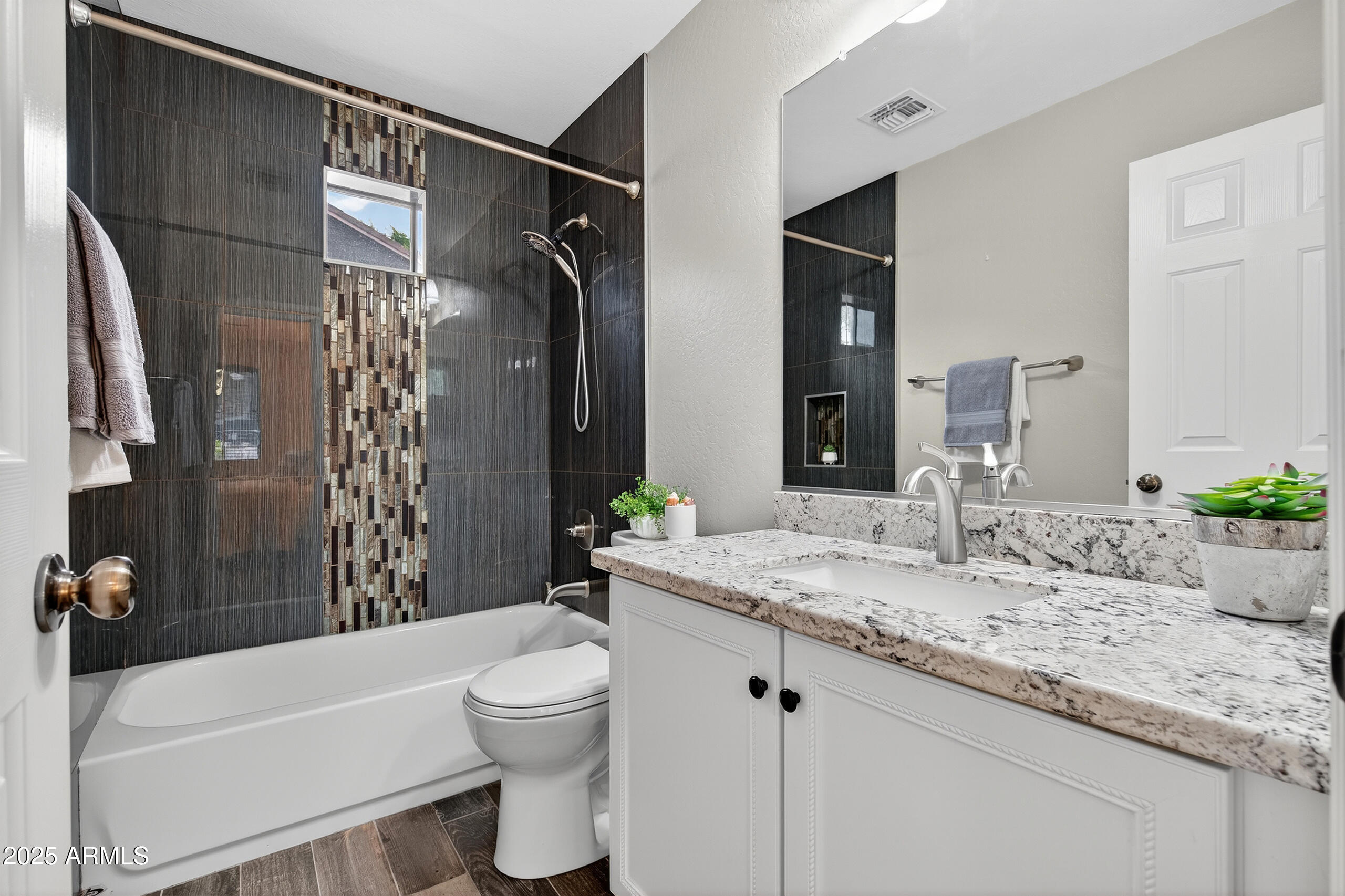 3021 East Agritopia Loop North Gilbert, AZ 85296 - Photo 47 of 68 a bathroom with a granite countertop sink toilet and shower