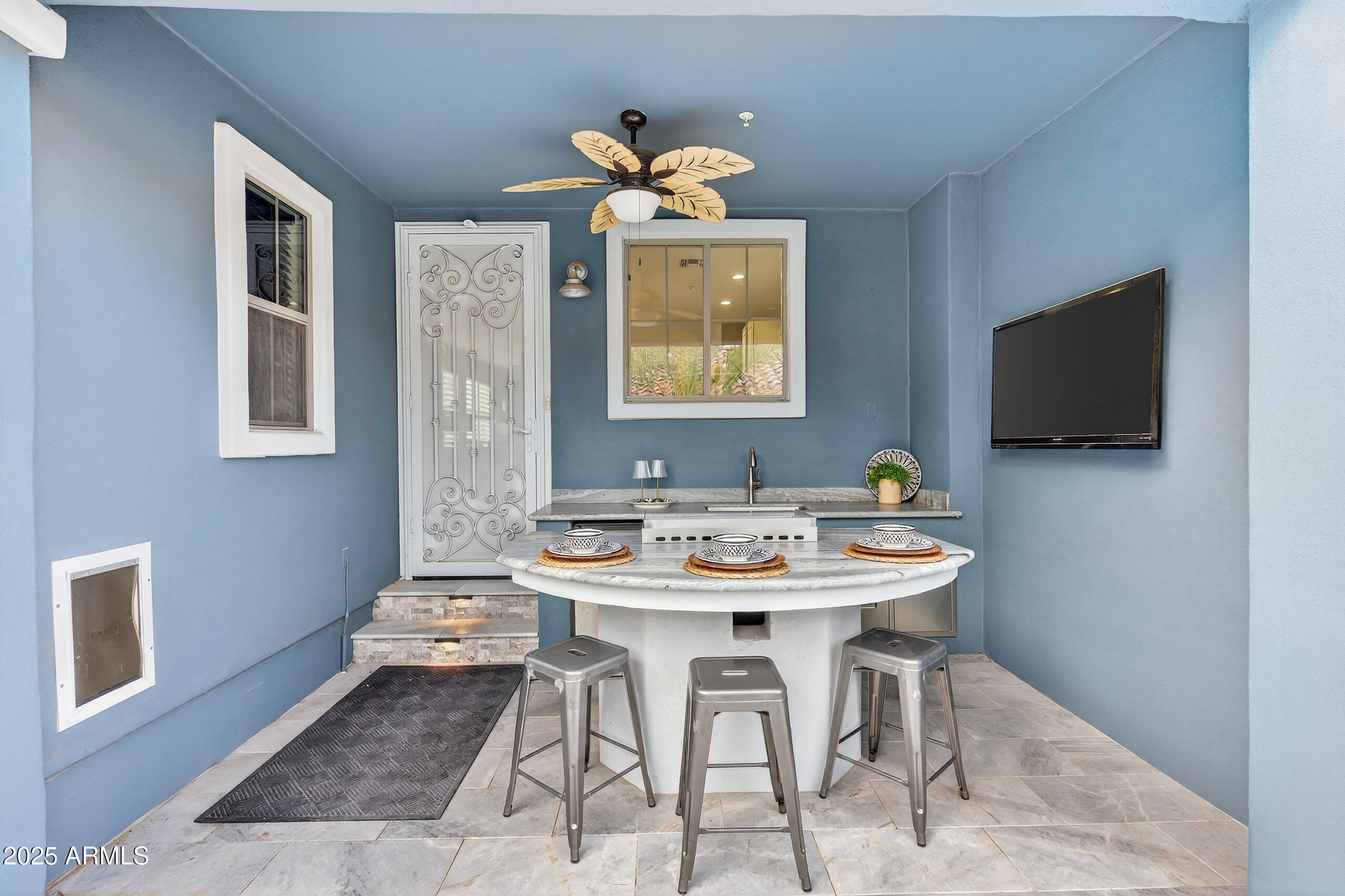 3021 East Agritopia Loop North Gilbert, AZ 85296 - Photo 49 of 68 a view of a livingroom with furniture and a flat screen tv
