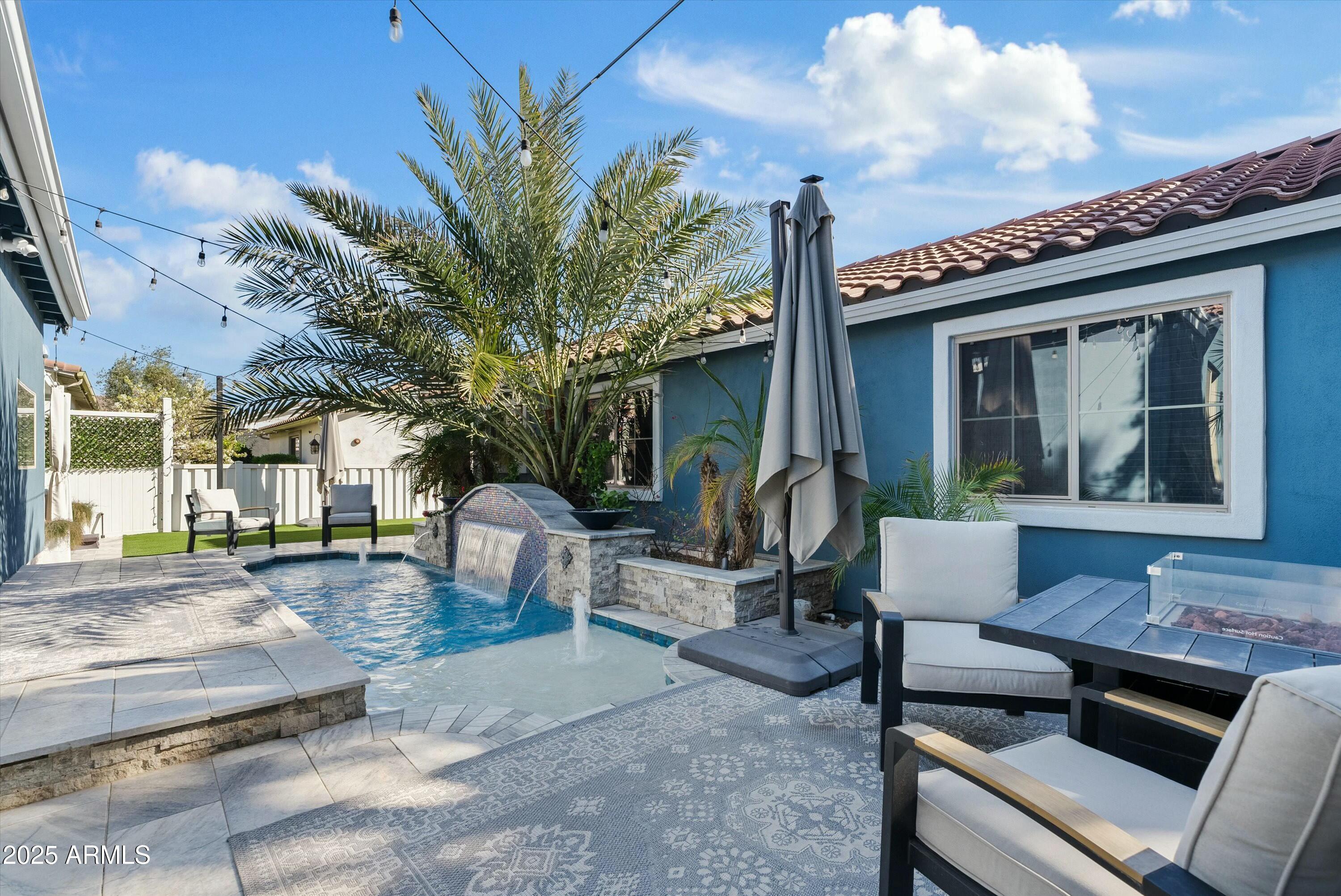 3021 East Agritopia Loop North Gilbert, AZ 85296 - Photo 55 of 68 a view of a house with backyard and sitting area