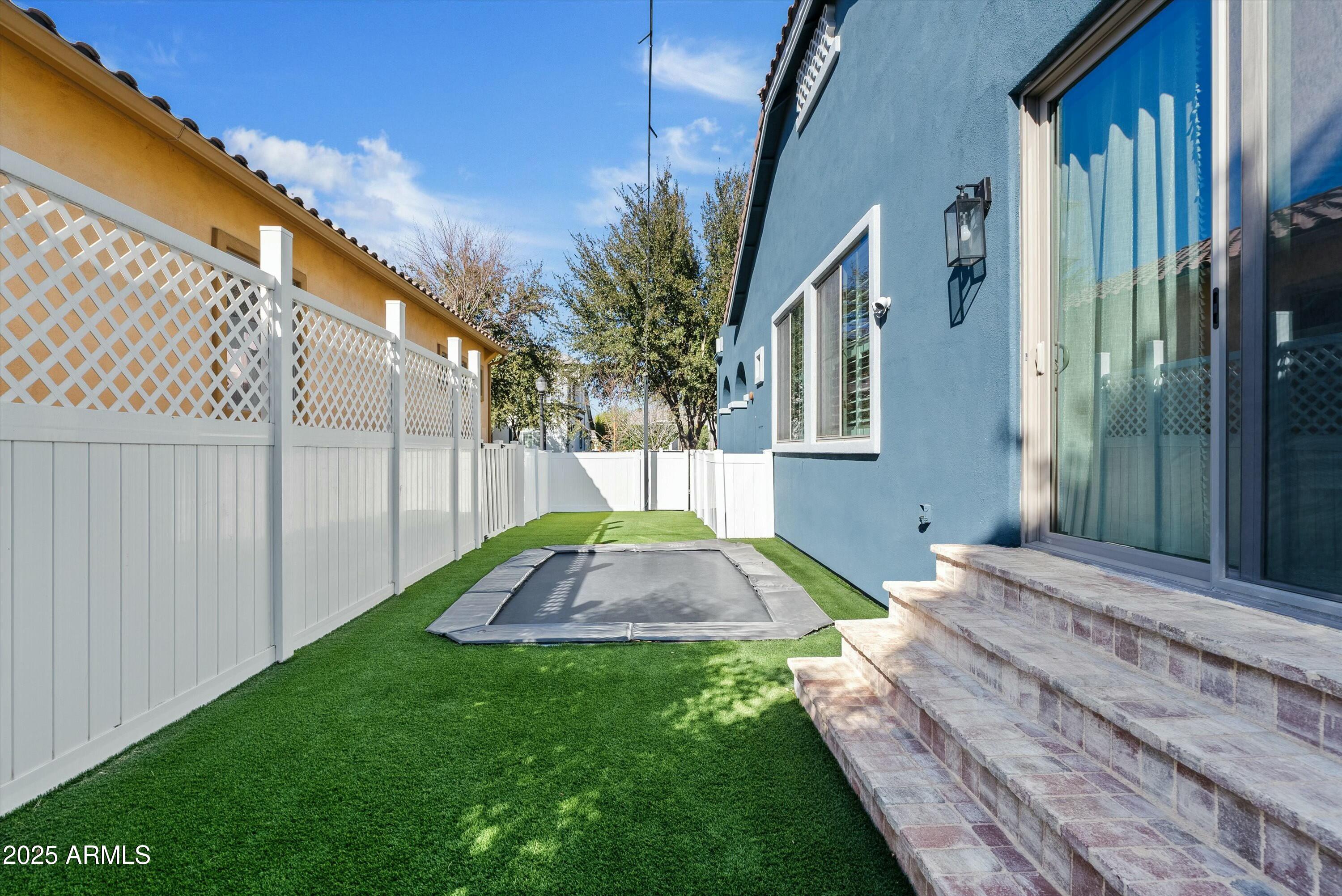 3021 East Agritopia Loop North Gilbert, AZ 85296 - Photo 59 of 68 a view of backyard with a garden and plants