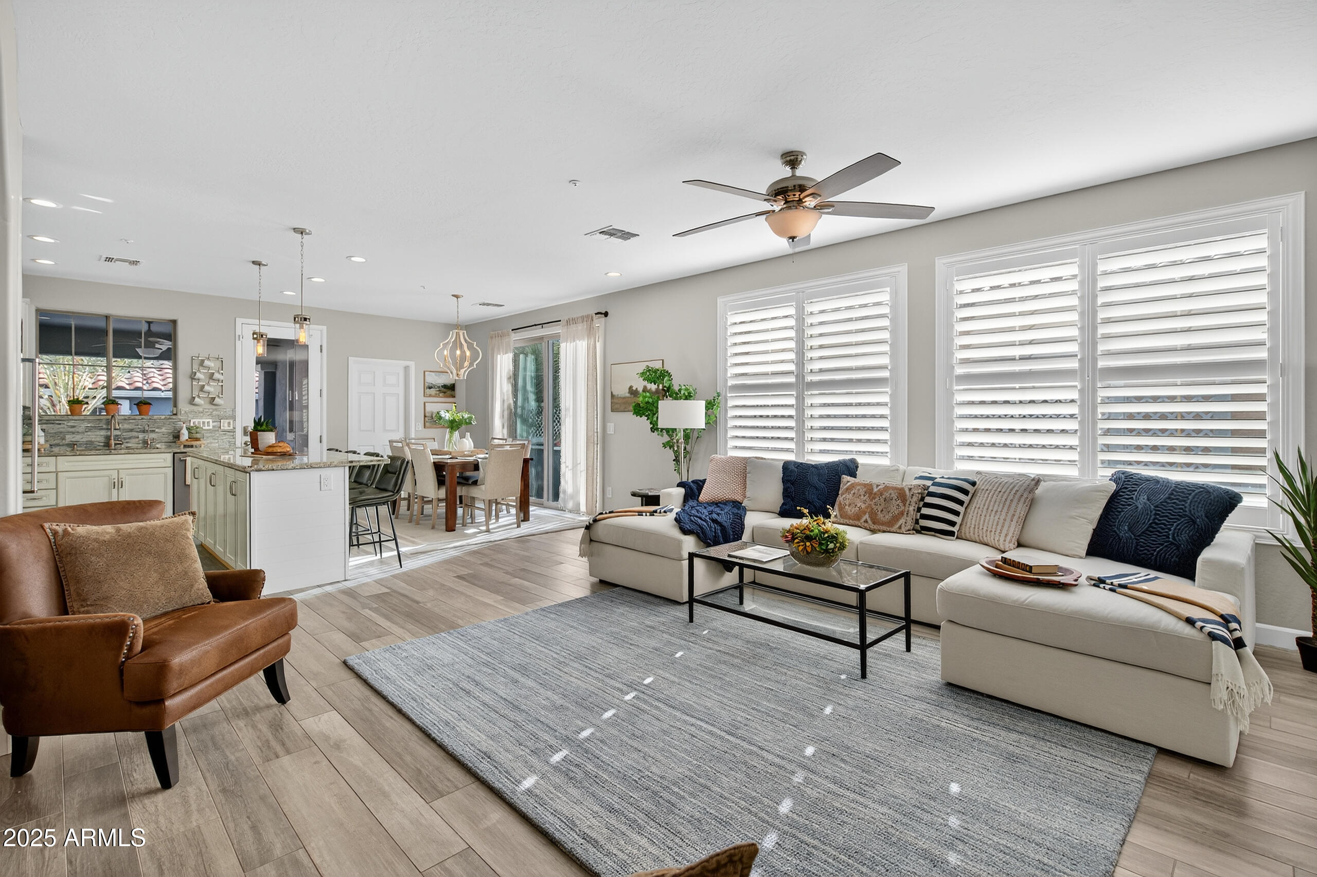 3021 East Agritopia Loop North Gilbert, AZ 85296 - Photo 7 of 68 a living room with furniture and a large window