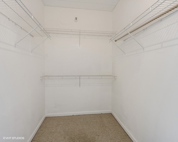 4848 North Sheridan Road, Unit 208 Chicago, IL 60640 - Photo 14 of 15 a view of a room with racks on the wall