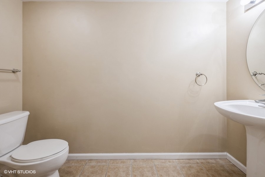 4848 North Sheridan Road, Unit 208 Chicago, IL 60640 - Photo 10 of 15 a white toilet sitting next to a shower