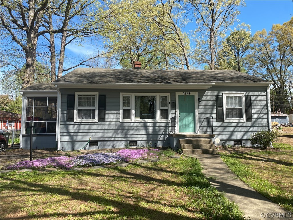 a house view with a garden space