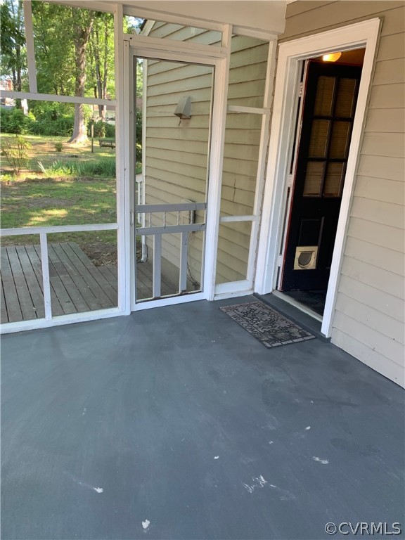 5254 Tilford Road Richmond, VA 23225 - Photo 11 of 13 a view of an empty room with a fireplace and a floor to ceiling window