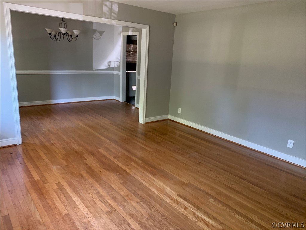 5254 Tilford Road Richmond, VA 23225 - Photo 3 of 13 a view of an empty room with wooden floor