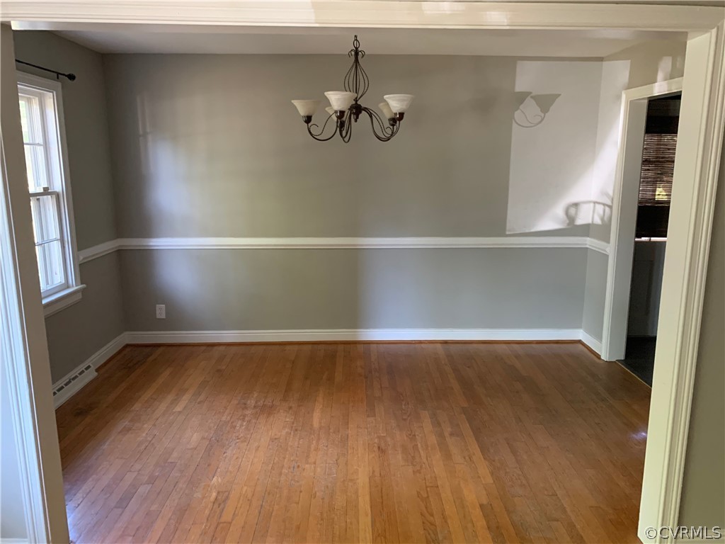 5254 Tilford Road Richmond, VA 23225 - Photo 4 of 13 a view of an empty room with wooden floor and a window