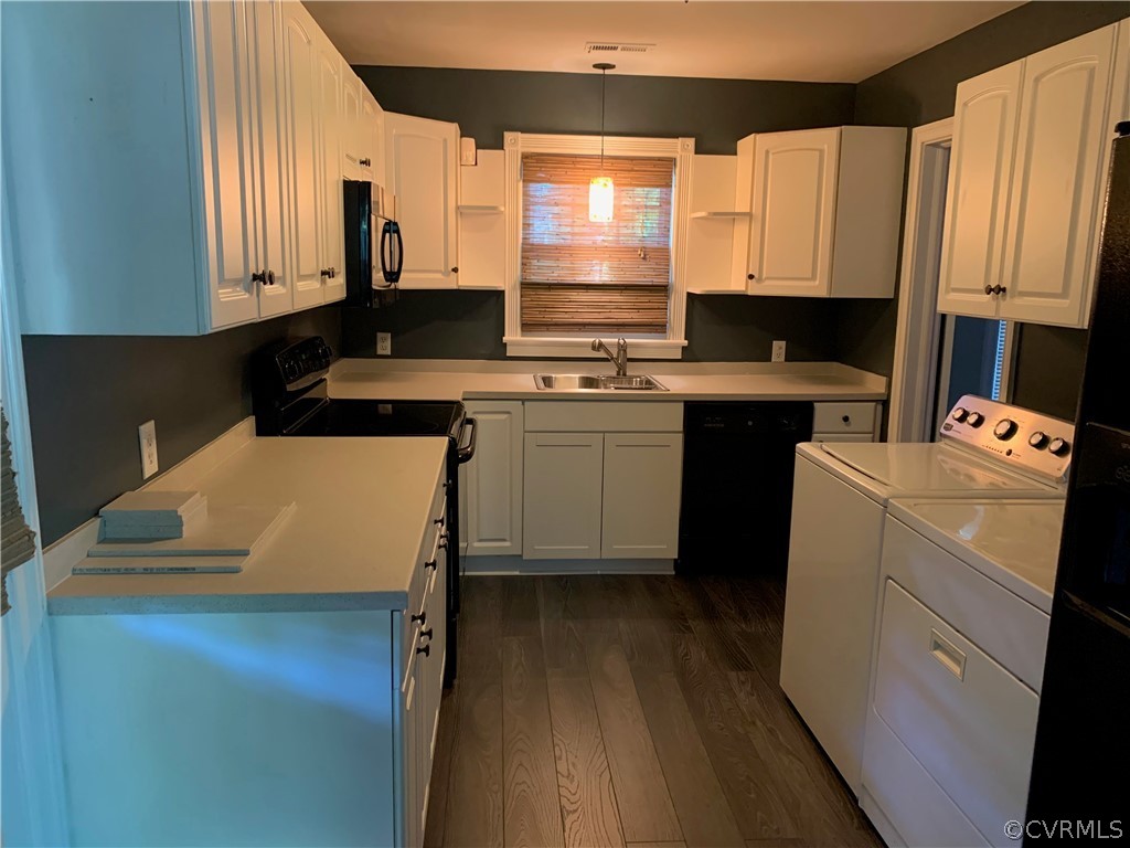 5254 Tilford Road Richmond, VA 23225 - Photo 5 of 13 a kitchen with a sink stove and cabinets