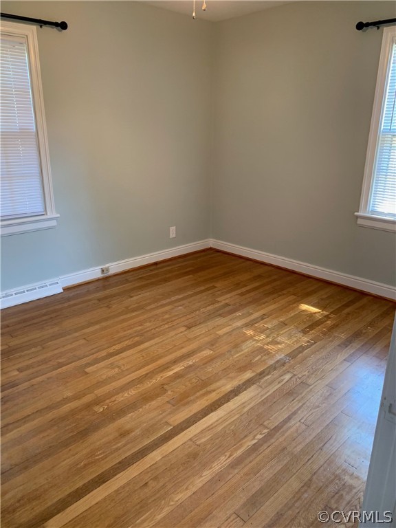 5254 Tilford Road Richmond, VA 23225 - Photo 7 of 13 a view of empty room with wooden floor and fan