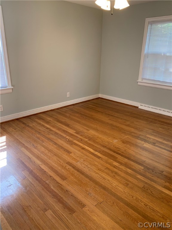 5254 Tilford Road Richmond, VA 23225 - Photo 8 of 13 a view of an empty room with wooden floor and a window