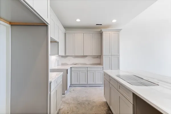 a kitchen with a sink and cabinets