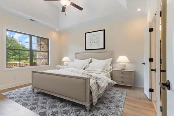 a bed room with a bed and a window