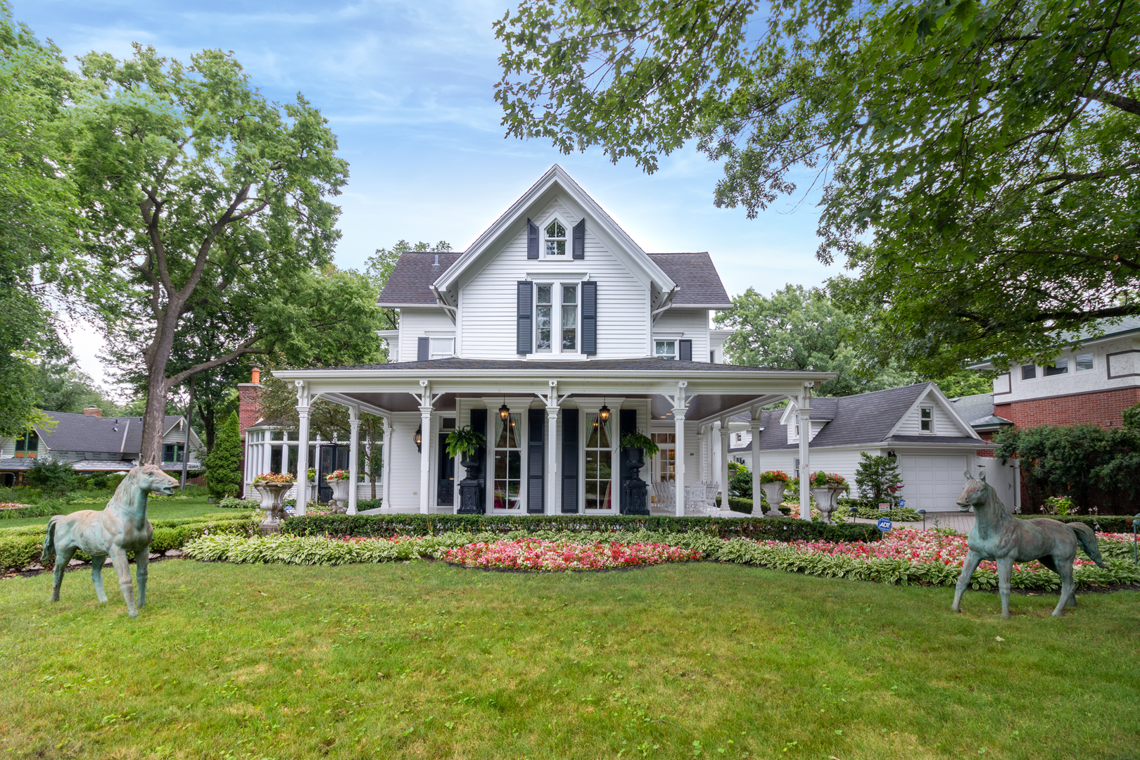 a front view of house with yard and green space