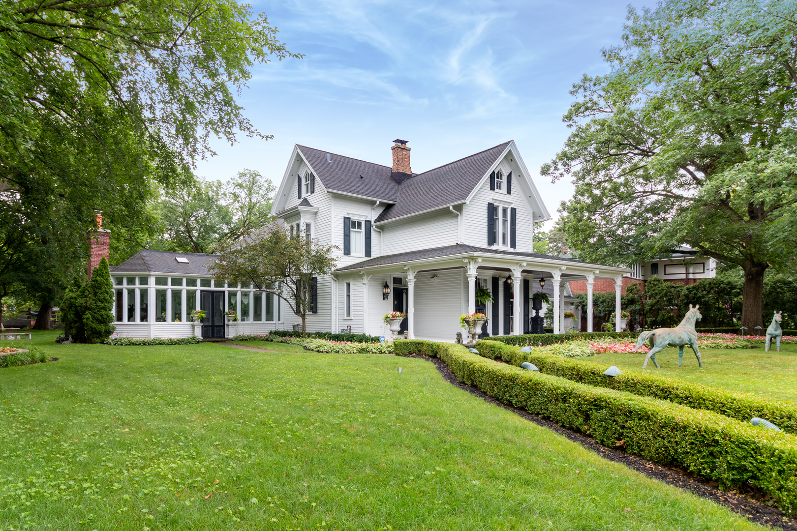 201 Scottswood Road Riverside, IL 60546 - Photo 2 of 75 a front view of a house with a yard and trees