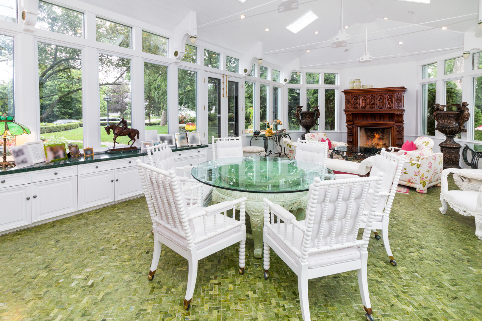 201 Scottswood Road Riverside, IL 60546 - Photo 23 of 75 a dining room with fireplace furniture and a large window