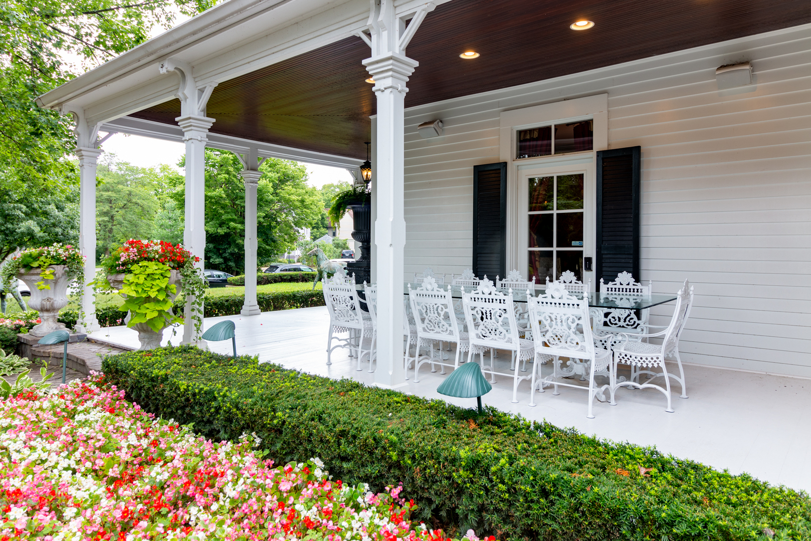 201 Scottswood Road Riverside, IL 60546 - Photo 5 of 75 a view of a patio with table and chairs and potted plants