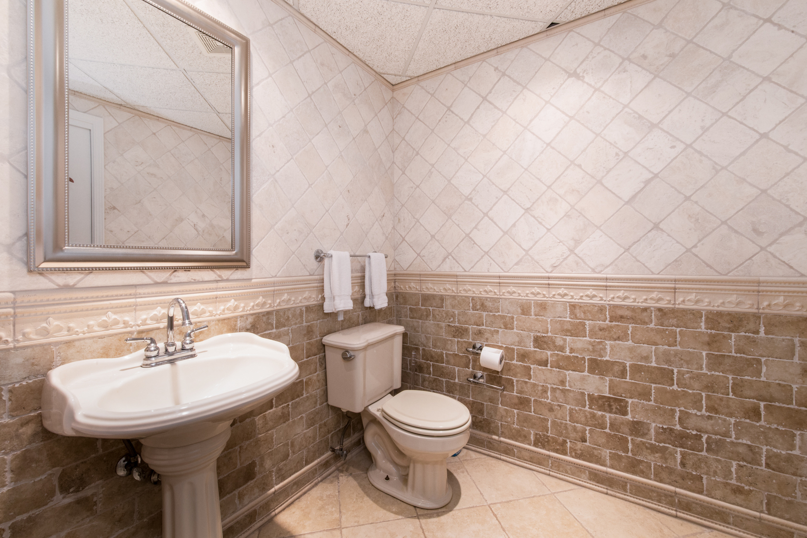 201 Scottswood Road Riverside, IL 60546 - Photo 67 of 75 a bathroom with a sink a toilet and a mirror