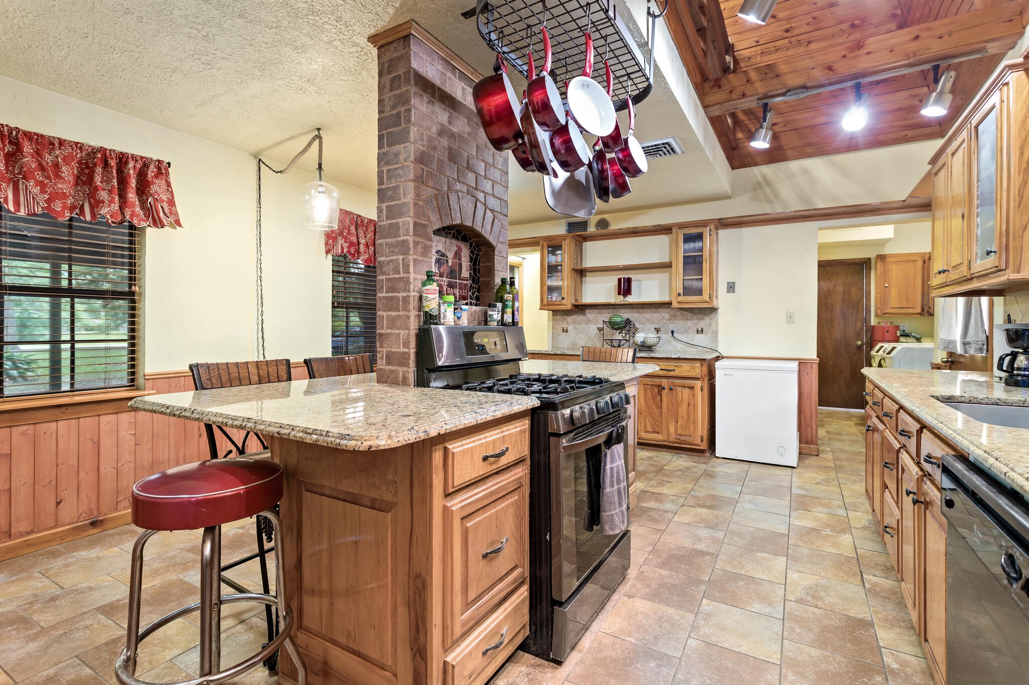 134 Sherwood Trail Silsbee, TX 77656 - Photo 15 of 41 a kitchen with stainless steel appliances granite countertop a stove a sink and a refrigerator