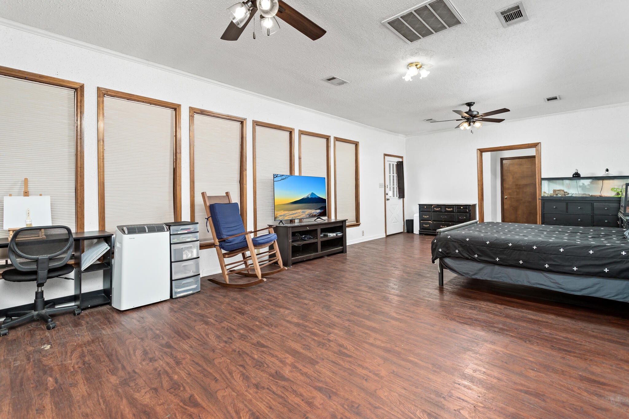 134 Sherwood Trail Silsbee, TX 77656 - Photo 19 of 41 a bedroom with furniture and a large window