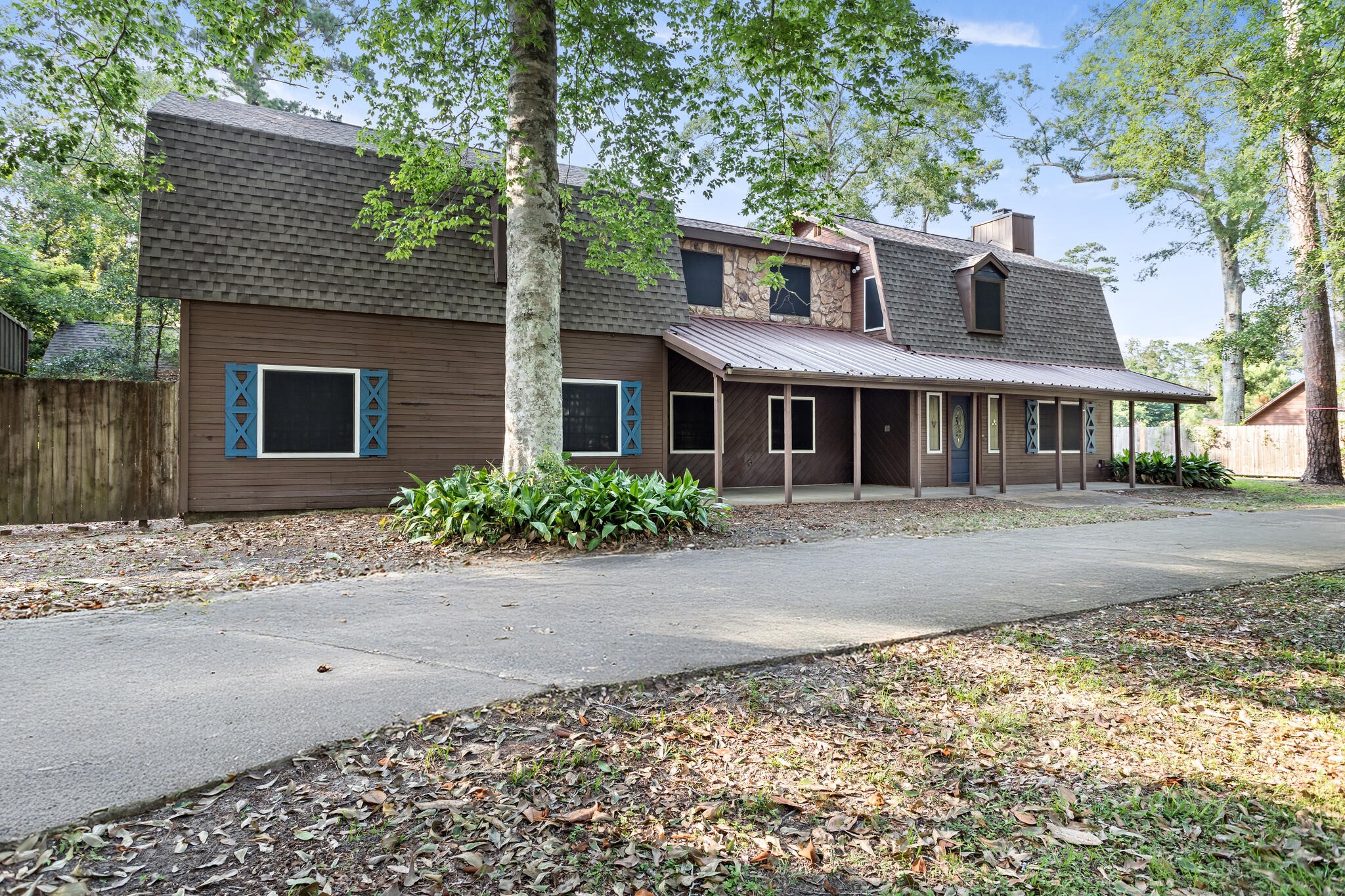 134 Sherwood Trail Silsbee, TX 77656 - Photo 2 of 41 a front view of a house with a garden