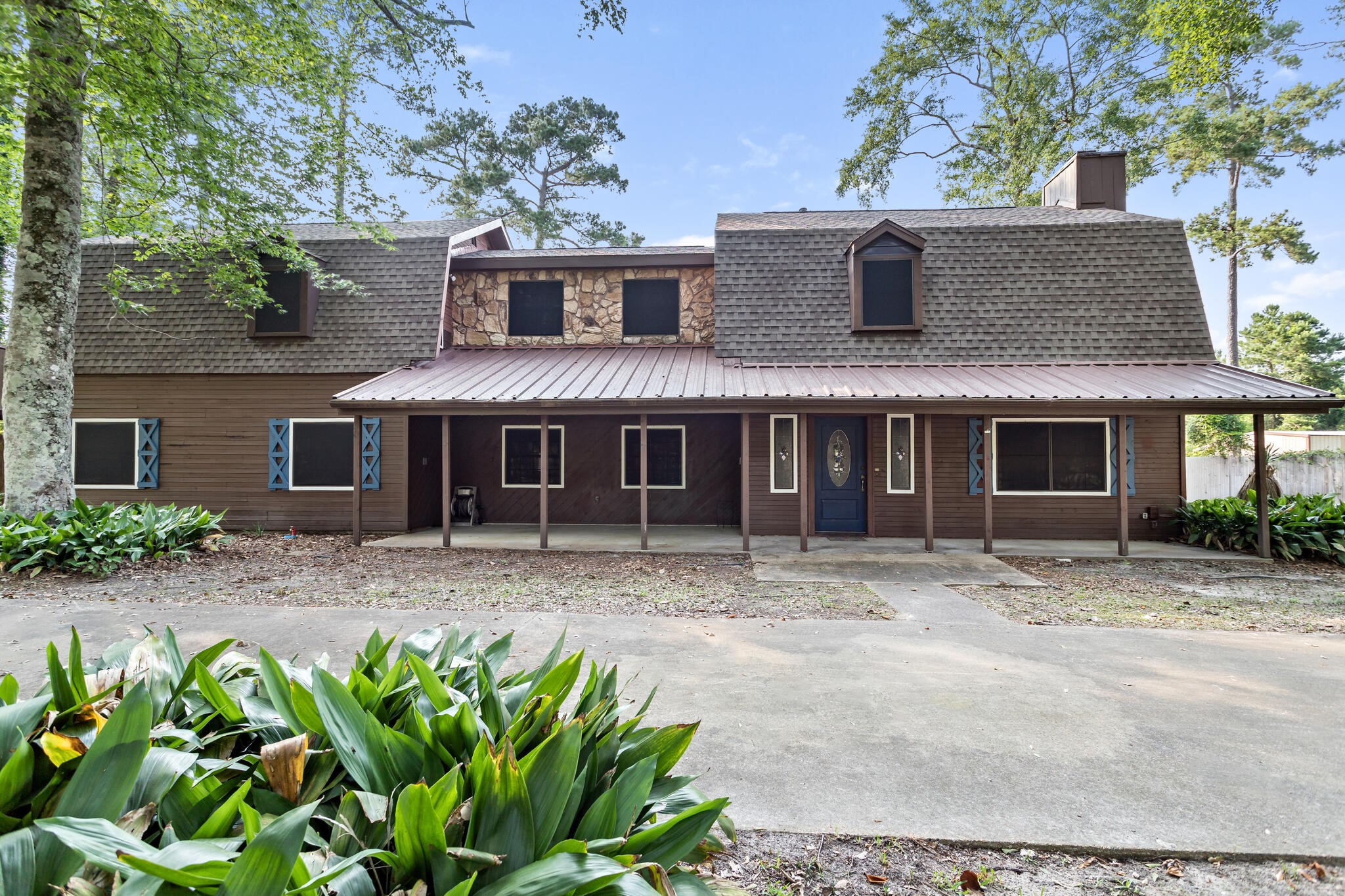 134 Sherwood Trail Silsbee, TX 77656 - Photo 3 of 41 a front view of a house with a yard