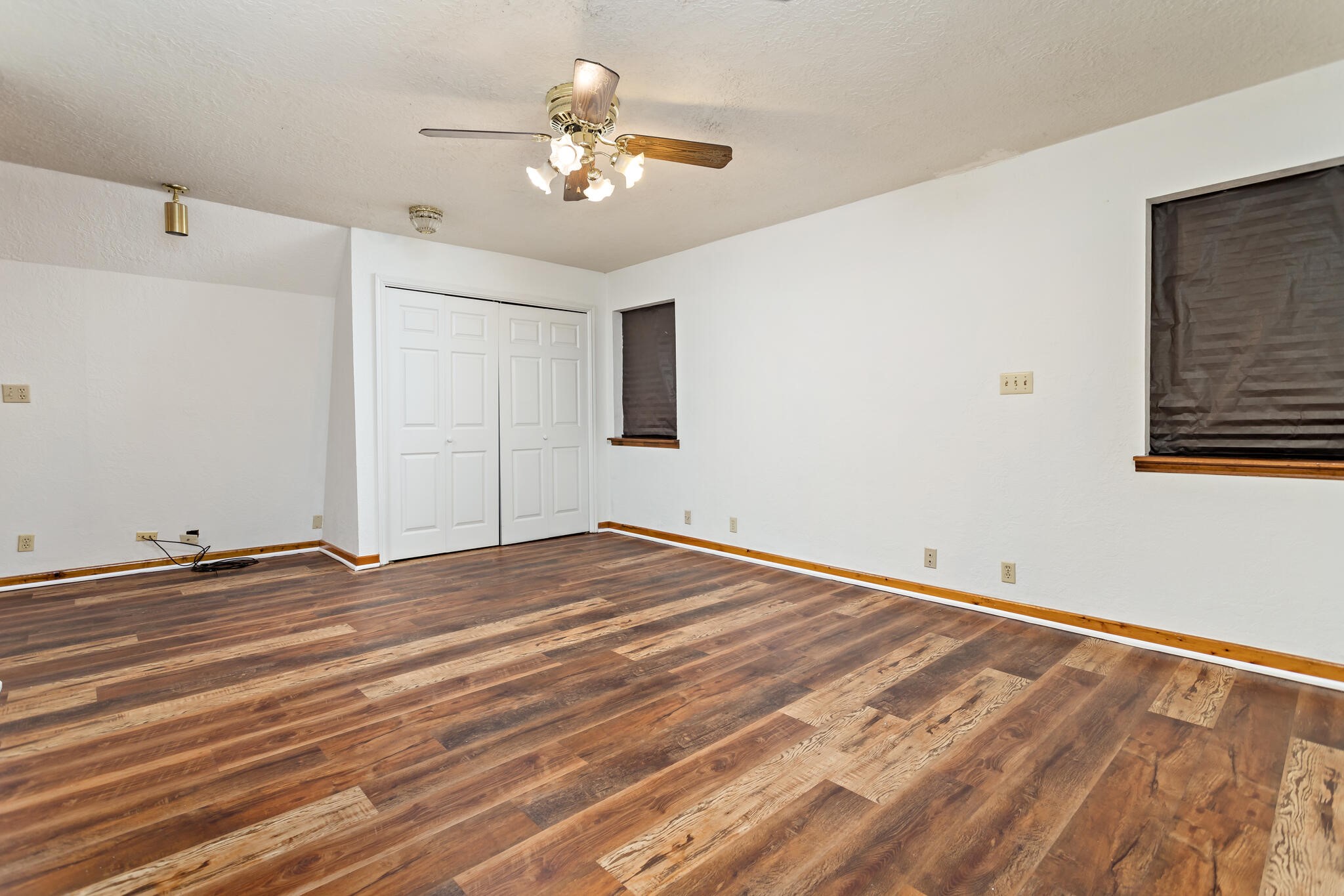 134 Sherwood Trail Silsbee, TX 77656 - Photo 31 of 41 a view of empty room with wooden floor and fan