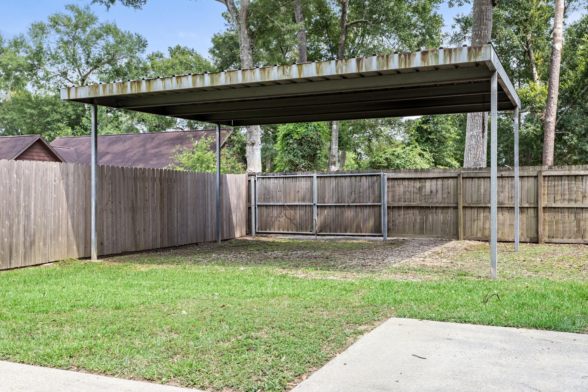 134 Sherwood Trail Silsbee, TX 77656 - Photo 40 of 41 a view of a backyard with a small cabin and a chair