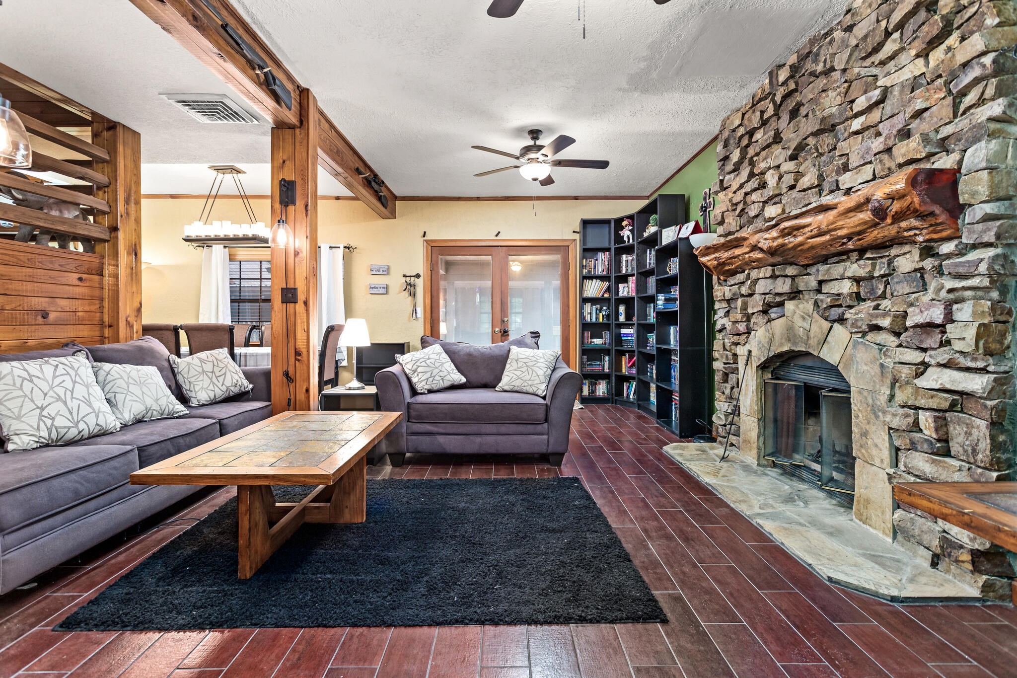 134 Sherwood Trail Silsbee, TX 77656 - Photo 10 of 41 a living room with furniture a fireplace and a chandelier