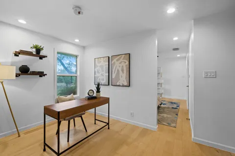 a workspace with furniture and window