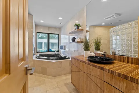 a kitchen with a sink and a stove top oven
