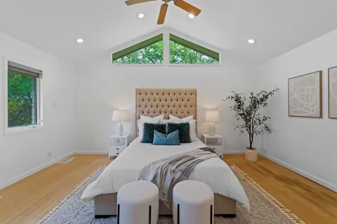 a bedroom with a bed and a window
