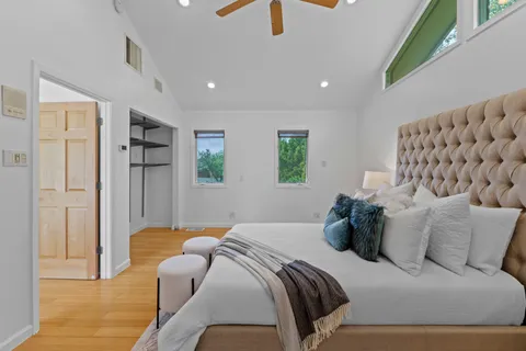 a bedroom with a bed and a couch