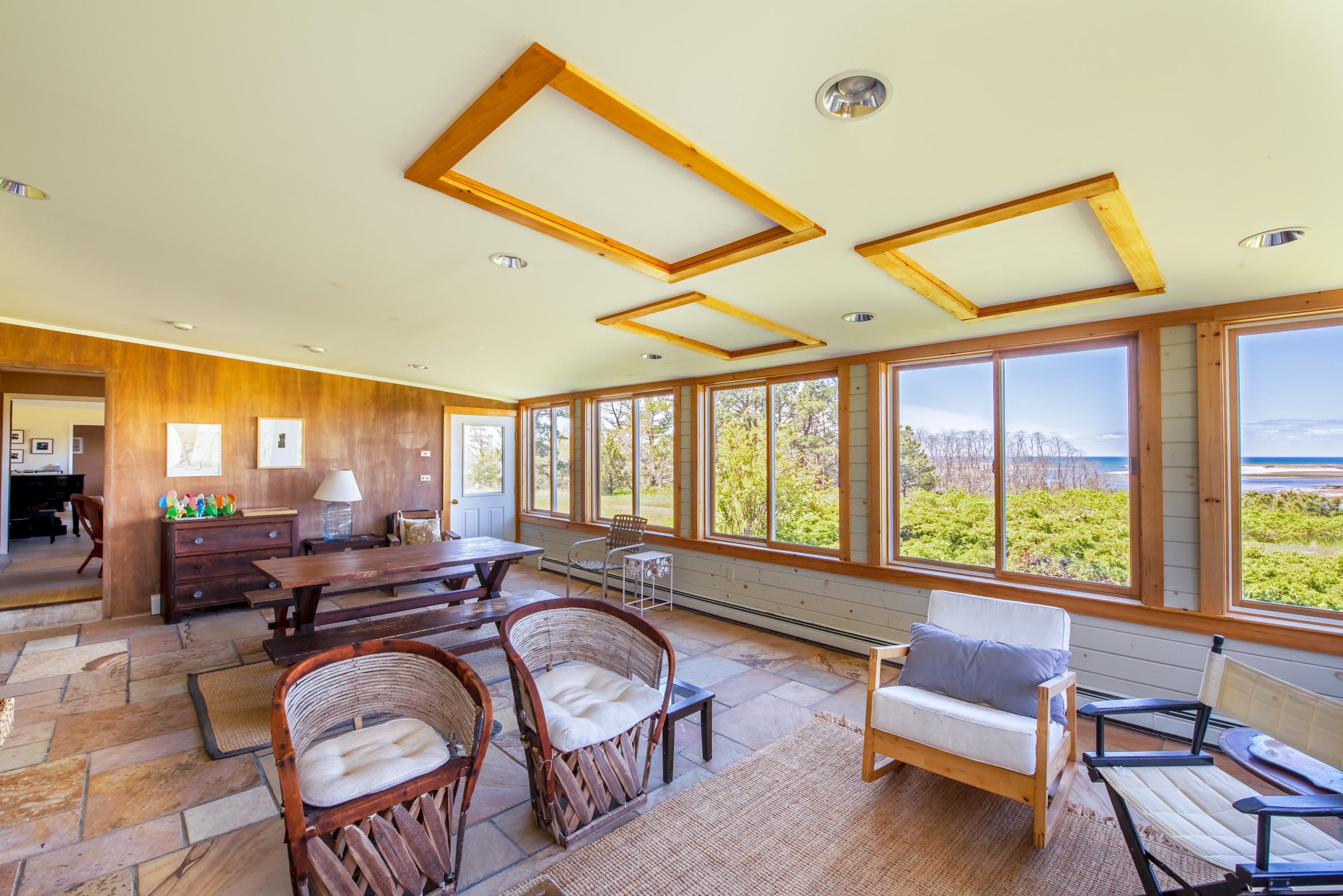 63 Depot Road Truro, MA 02666 - Photo 16 of 36 a very nice looking living room with furniture and floor to ceiling windows