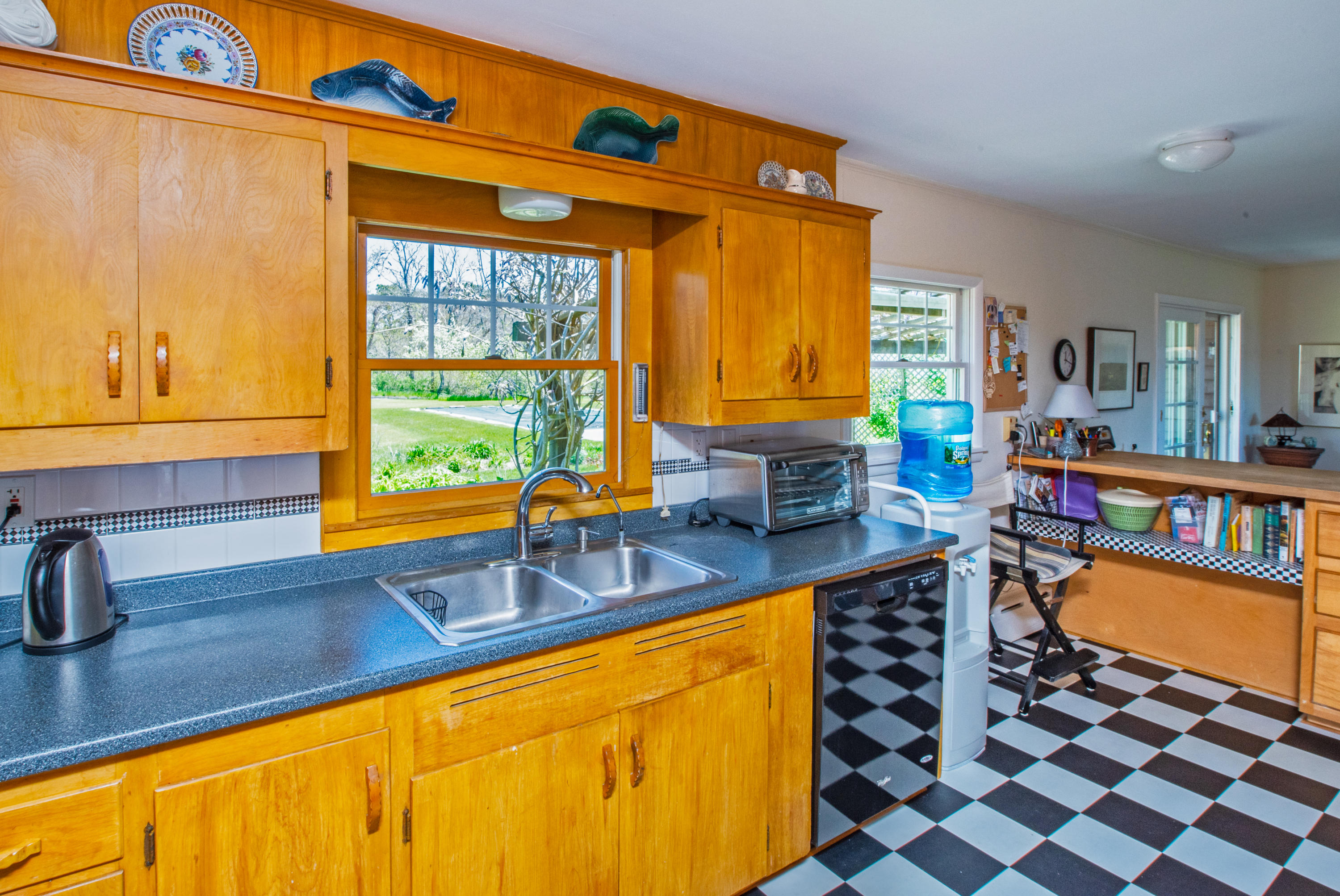 63 Depot Road Truro, MA 02666 - Photo 20 of 36 a kitchen with stainless steel appliances a sink and a counter top space