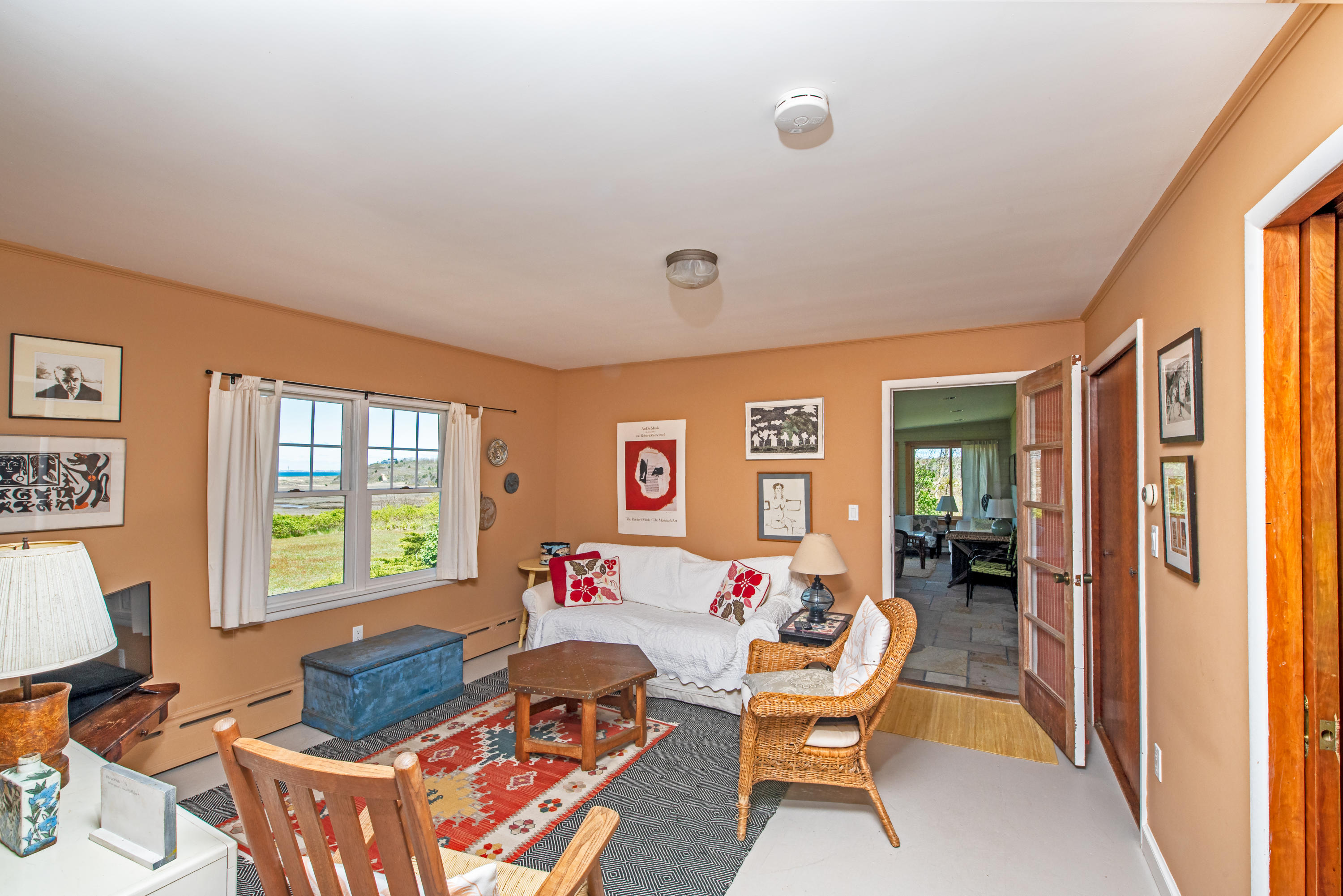 63 Depot Road Truro, MA 02666 - Photo 21 of 36 a living room with furniture and a window