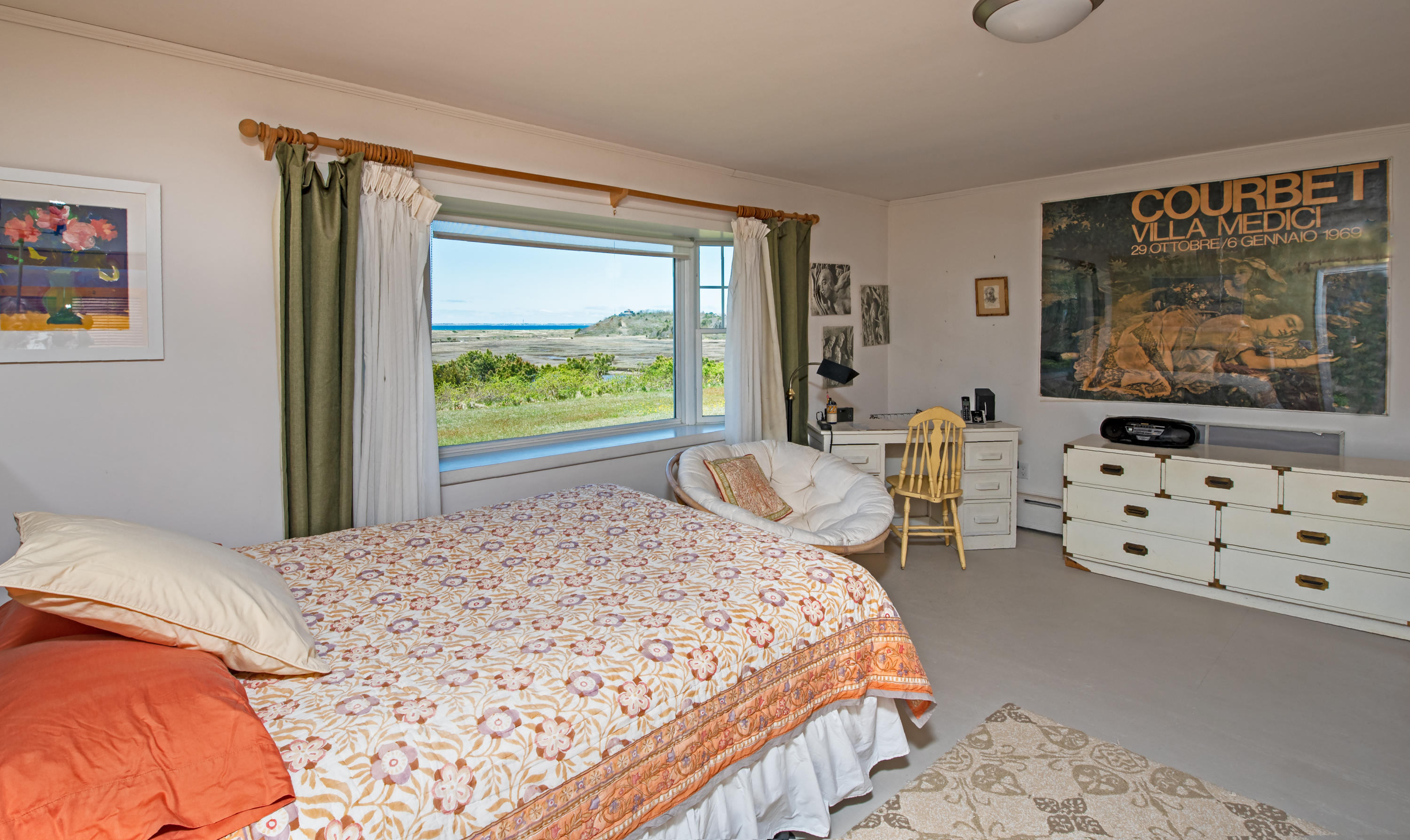 63 Depot Road Truro, MA 02666 - Photo 22 of 36 a bedroom with a bed a dresser next to a window