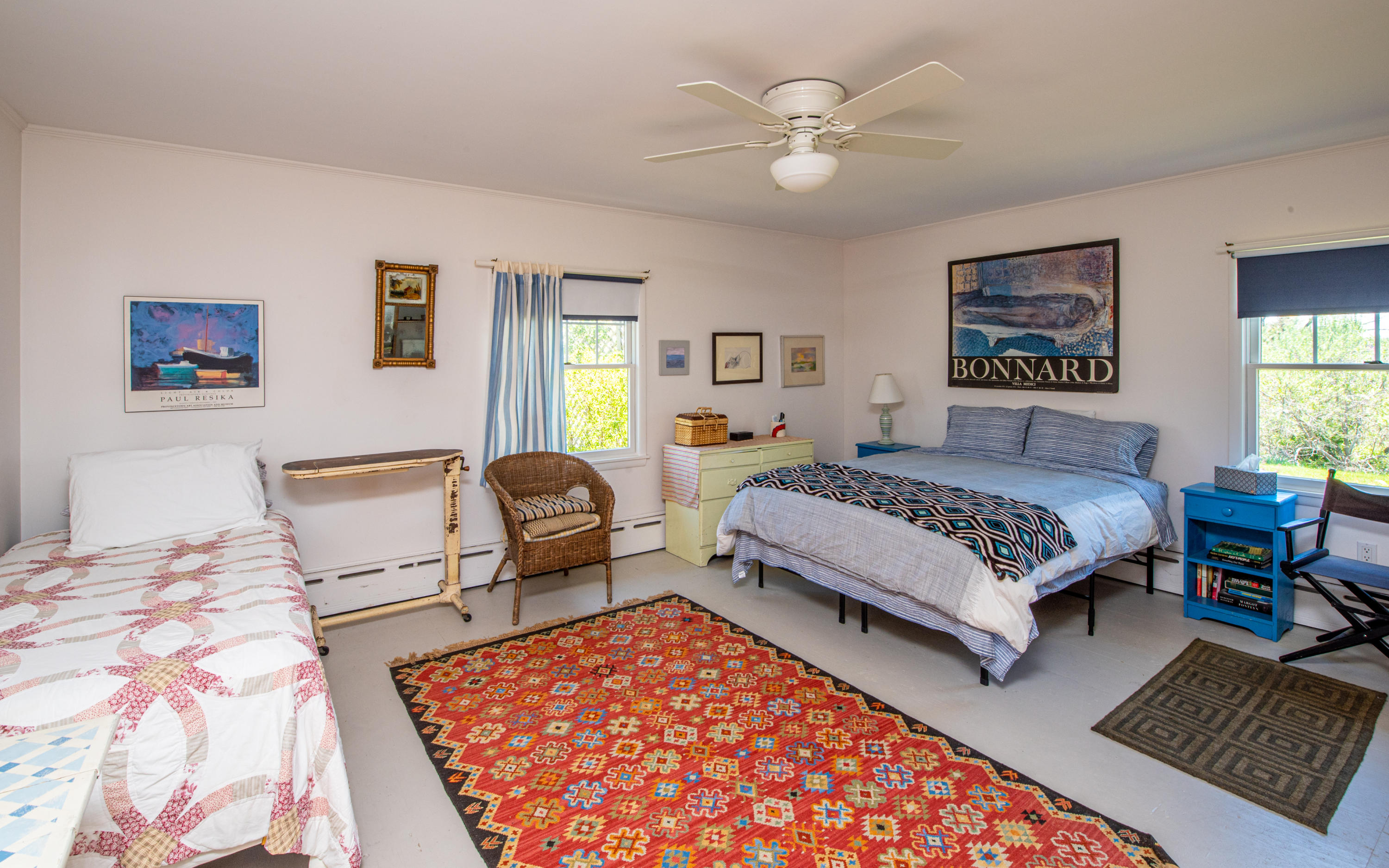 63 Depot Road Truro, MA 02666 - Photo 25 of 36 a bedroom with a large bed and a window