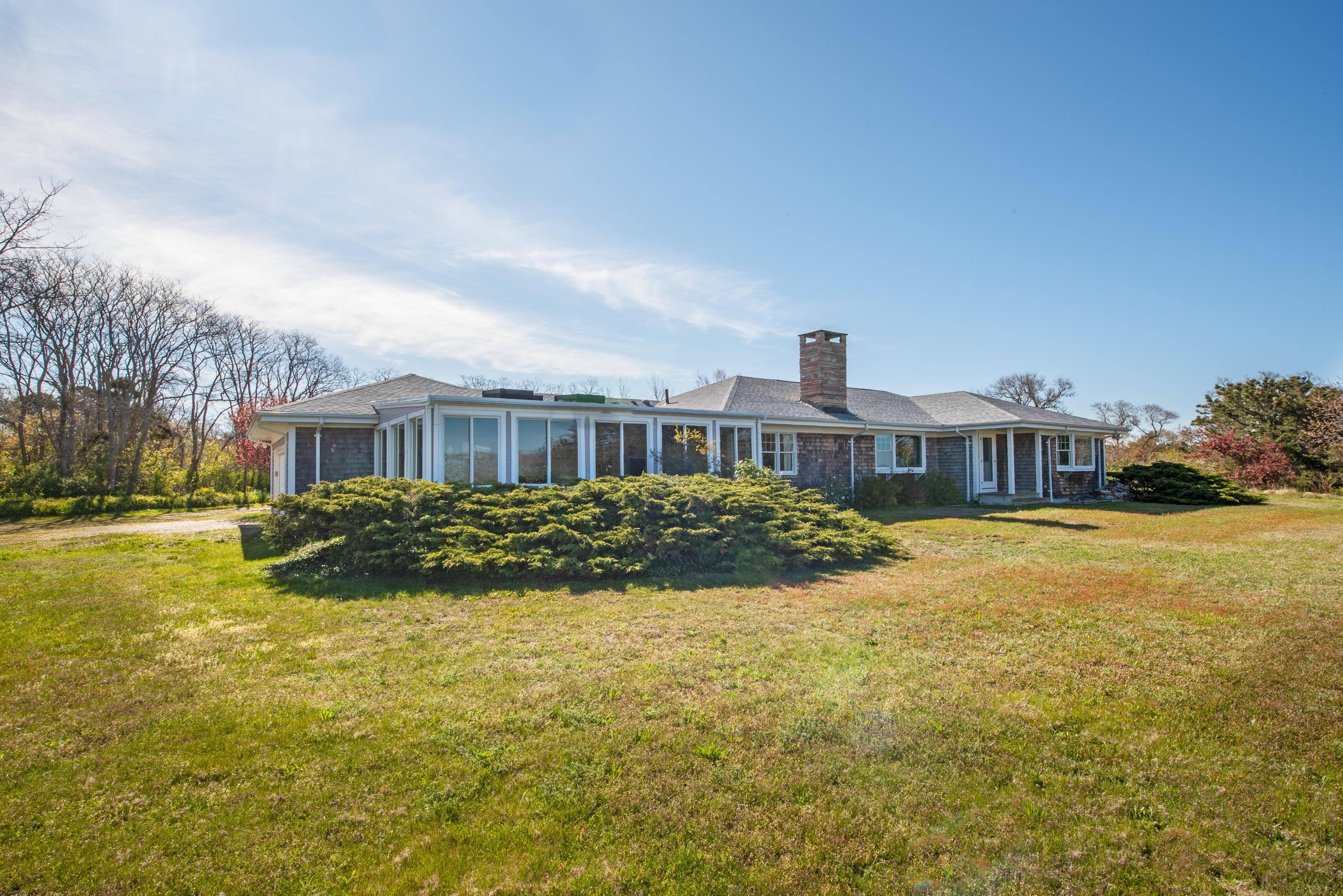 63 Depot Road Truro, MA 02666 - Photo 26 of 36 a front view of a house with a yard