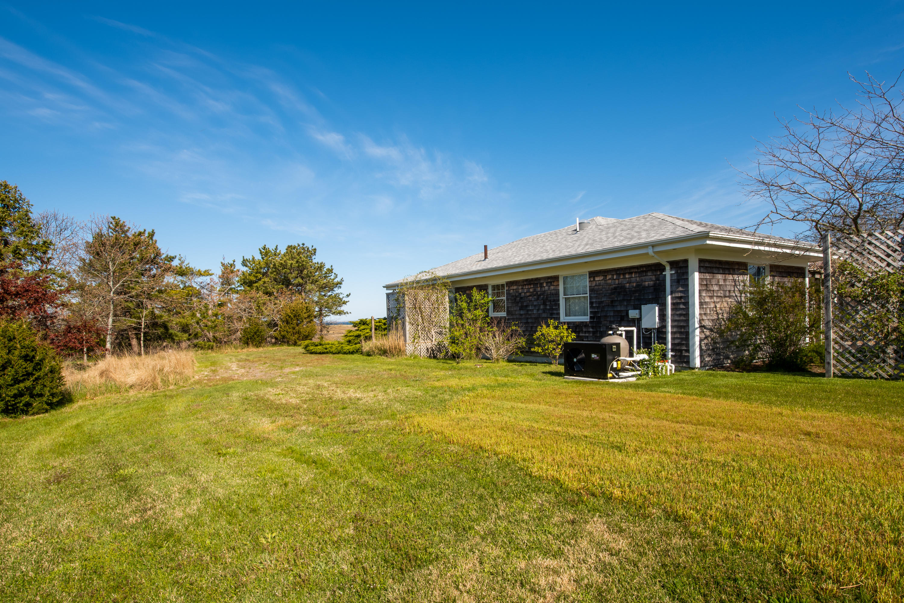 63 Depot Road Truro, MA 02666 - Photo 31 of 36 a view of a house with patio and garden