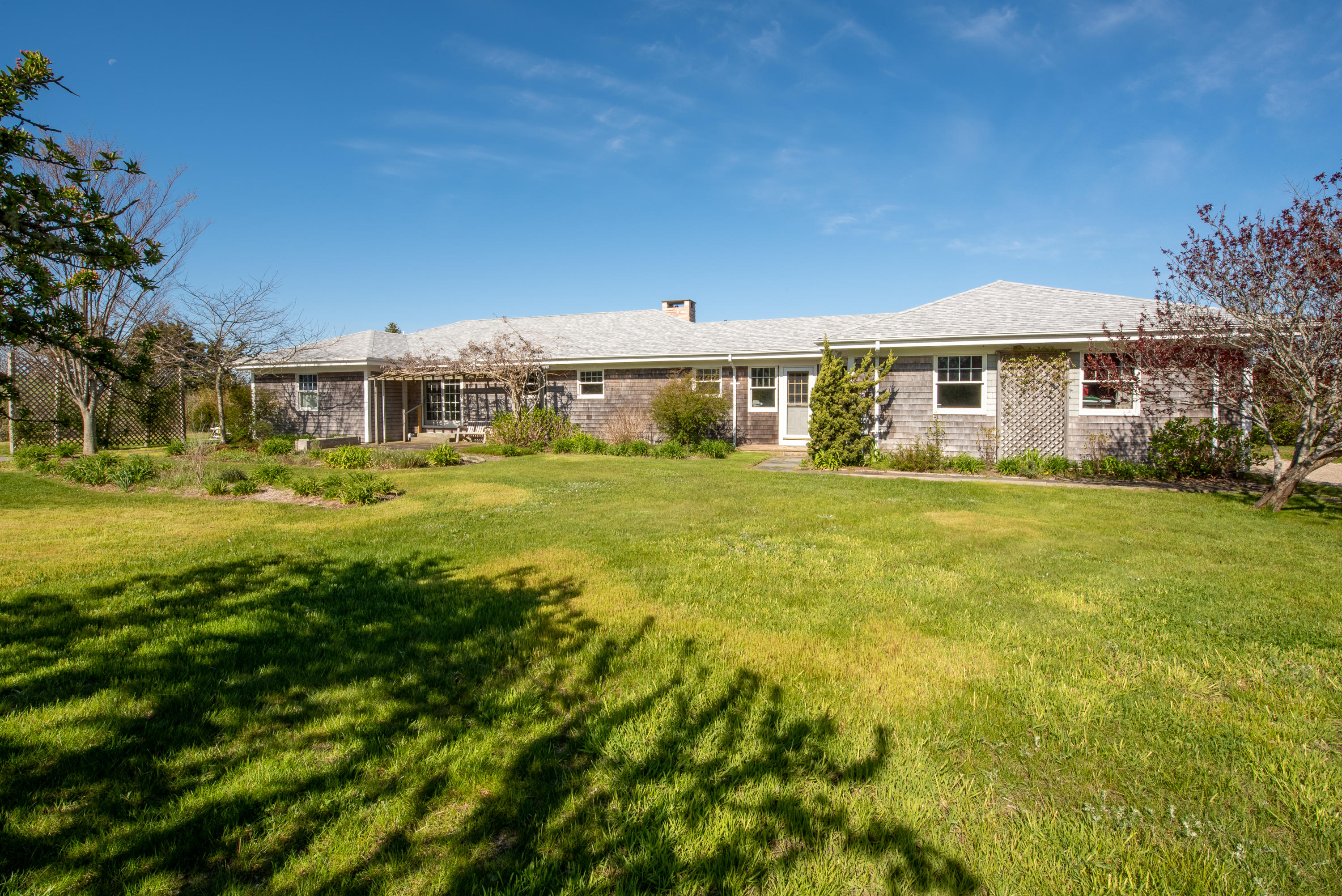63 Depot Road Truro, MA 02666 - Photo 33 of 36 a front view of a house with a garden