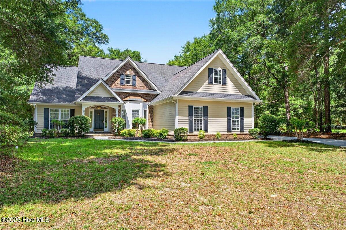 8985 Woodbine Road Southwest Sunset Beach, NC 28468 - Photo 5 of 65 Front exterior