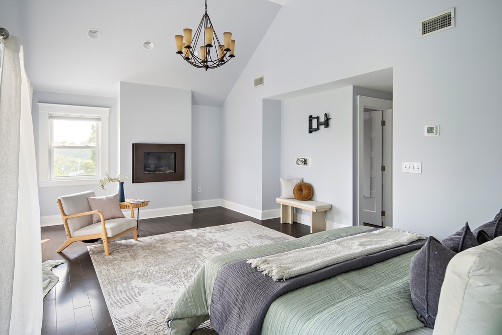 60 Rosemary Street Needham, MA 02494 - Photo 11 of 29 a bedroom with a bed and a tv