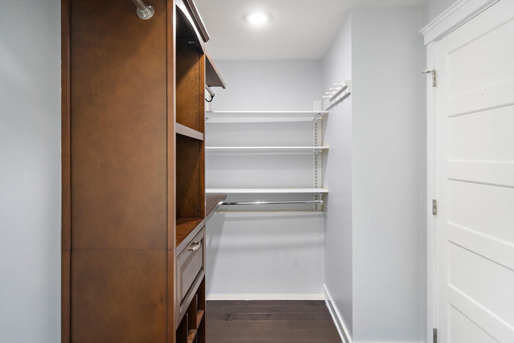 60 Rosemary Street Needham, MA 02494 - Photo 14 of 29 a view of walk in closet with empty racks