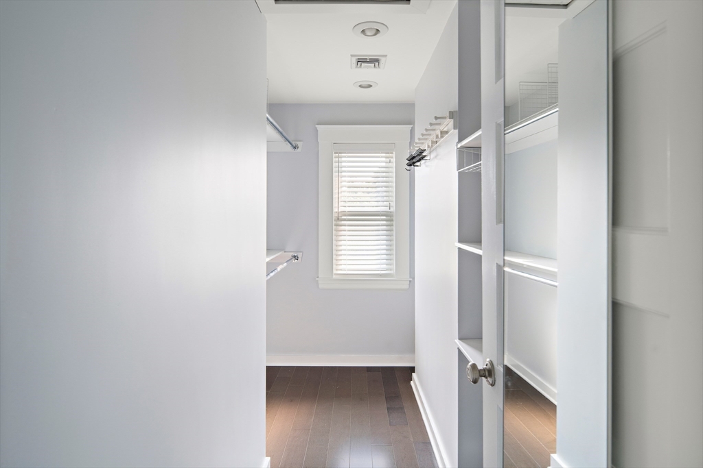 60 Rosemary Street Needham, MA 02494 - Photo 15 of 29 a view of a hallway with a white walls