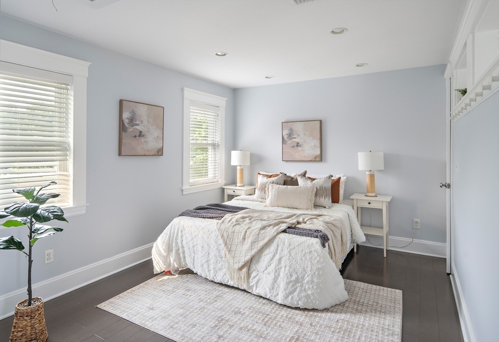 60 Rosemary Street Needham, MA 02494 - Photo 17 of 29 a bed room with a bed and a potted plant