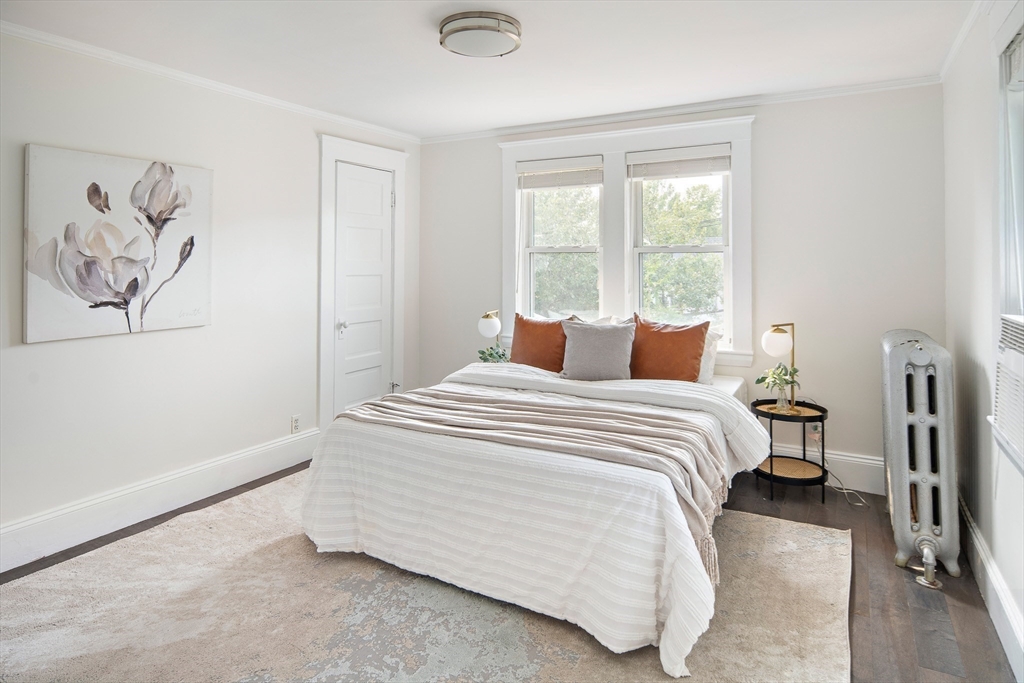 60 Rosemary Street Needham, MA 02494 - Photo 20 of 29 a bedroom with a bed and a painting on the wall